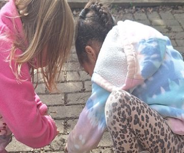 Kids engaged in play-based preschool programs with teachers